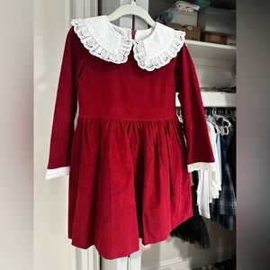 Burgundy girls dress with lace collar and trim at sleeve.